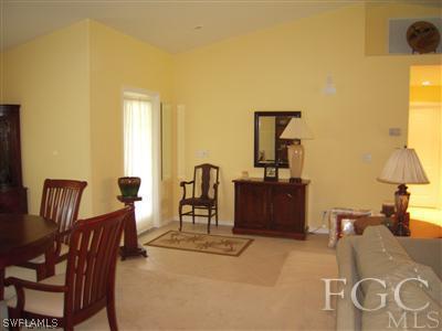 17187 Malaga Road Fort Myers, FL 33967 - Photo 4 of 9 a living room with furniture and a table
