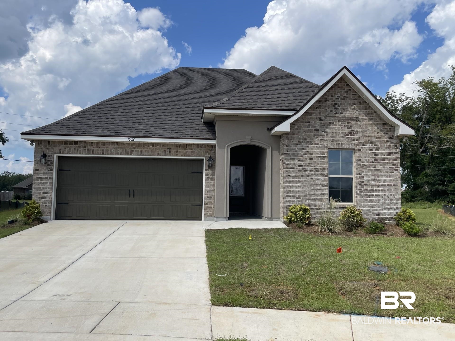 1602 Fenton Circle Foley, AL 36535 - Photo 1 of 3 View of front of property with a front yard and a garage