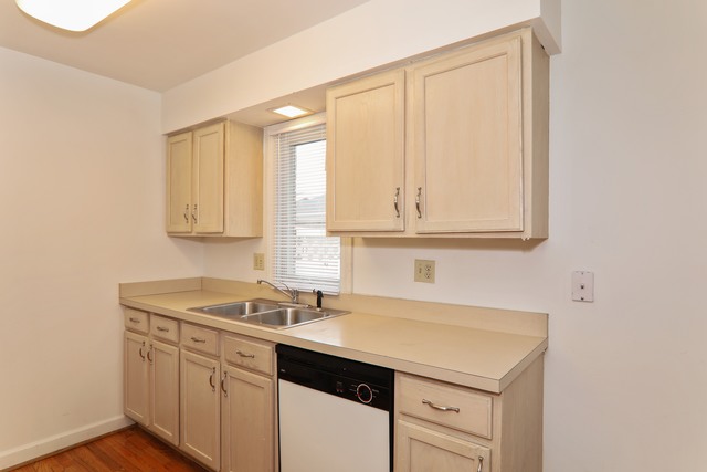 4201 Cumnor Road Downers Grove, IL 60515 - Photo 4 of 10 a kitchen with a sink cabinets and a window