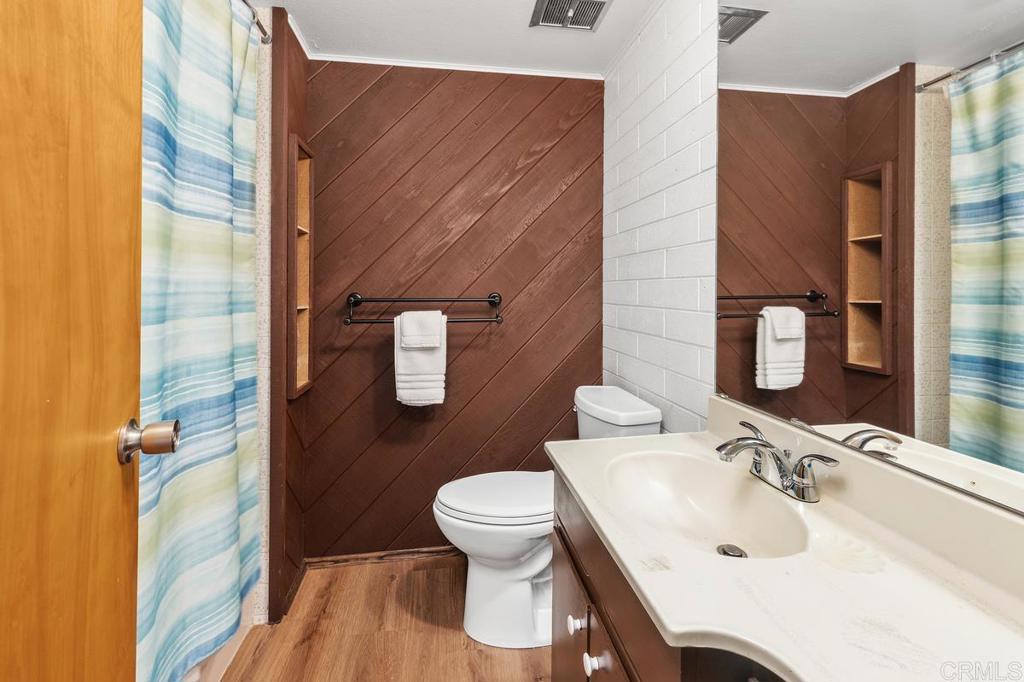 16522 Orchard Bend Road Poway, CA 92064 - Photo 16 of 26 a bathroom with a sink a toilet and shower