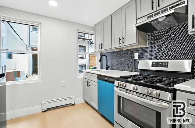 a kitchen with granite countertop a stove and a sink