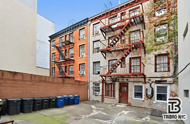 a front view of a building with parking