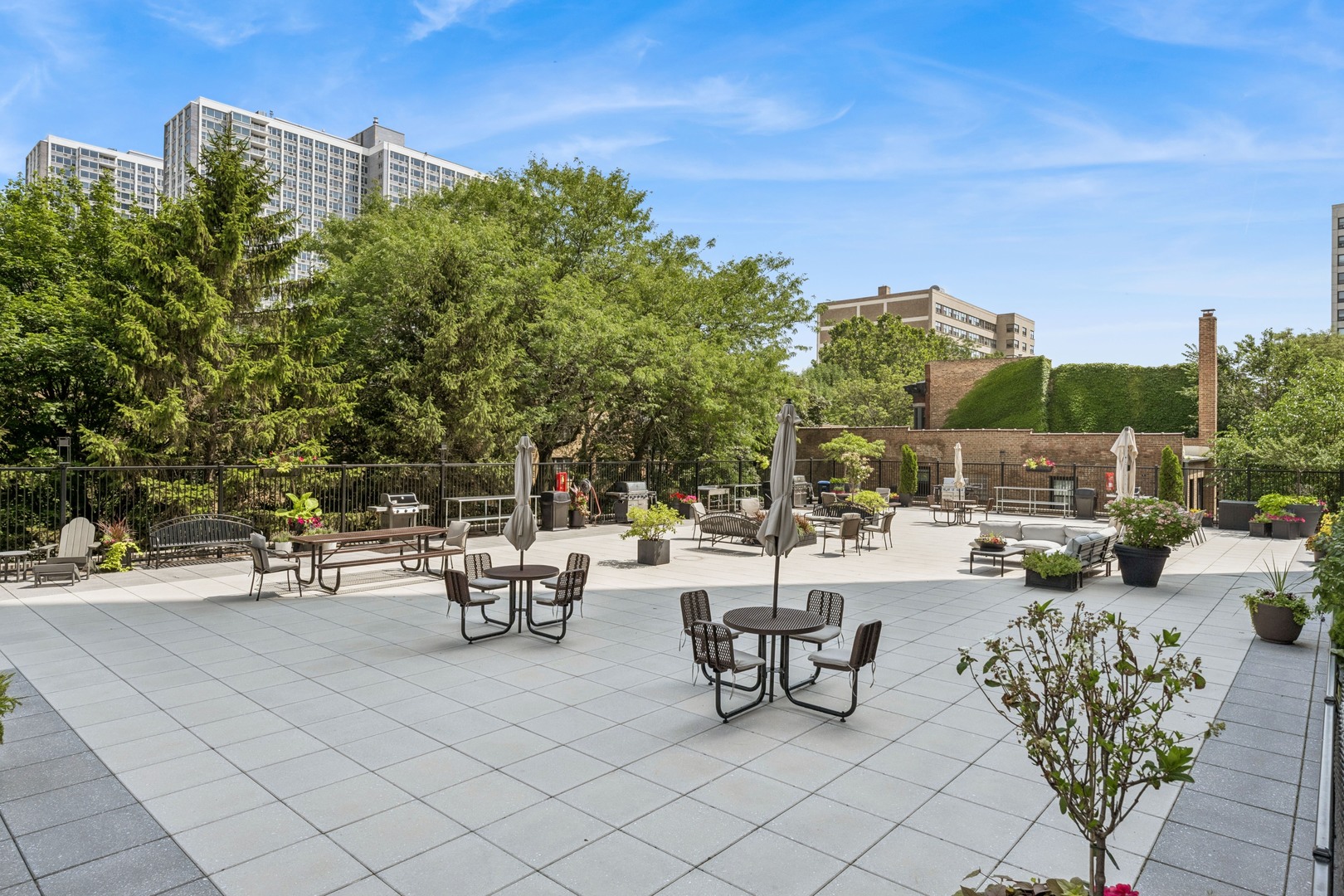Undisclosed Address Chicago, IL 60613 - Photo 14 of 15 a view of a terrace with furniture and a fire pit