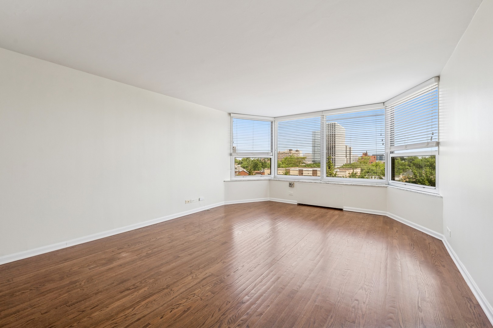 Undisclosed Address Chicago, IL 60613 - Photo 10 of 15 a view of a kitchen with wooden floor and electronic appliances