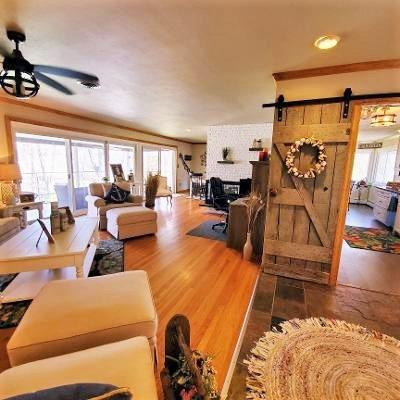 42 Ogden Road Portage, IN 46368 - Photo 15 of 40 a living room with furniture gym equipment and a large window