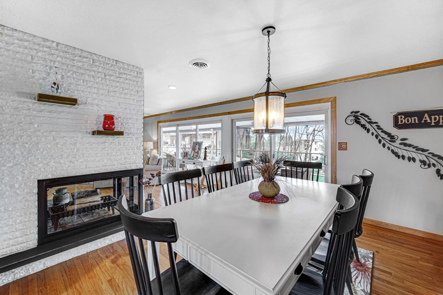 42 Ogden Road Portage, IN 46368 - Photo 17 of 40 a dining room with furniture a chandelier and wooden floor