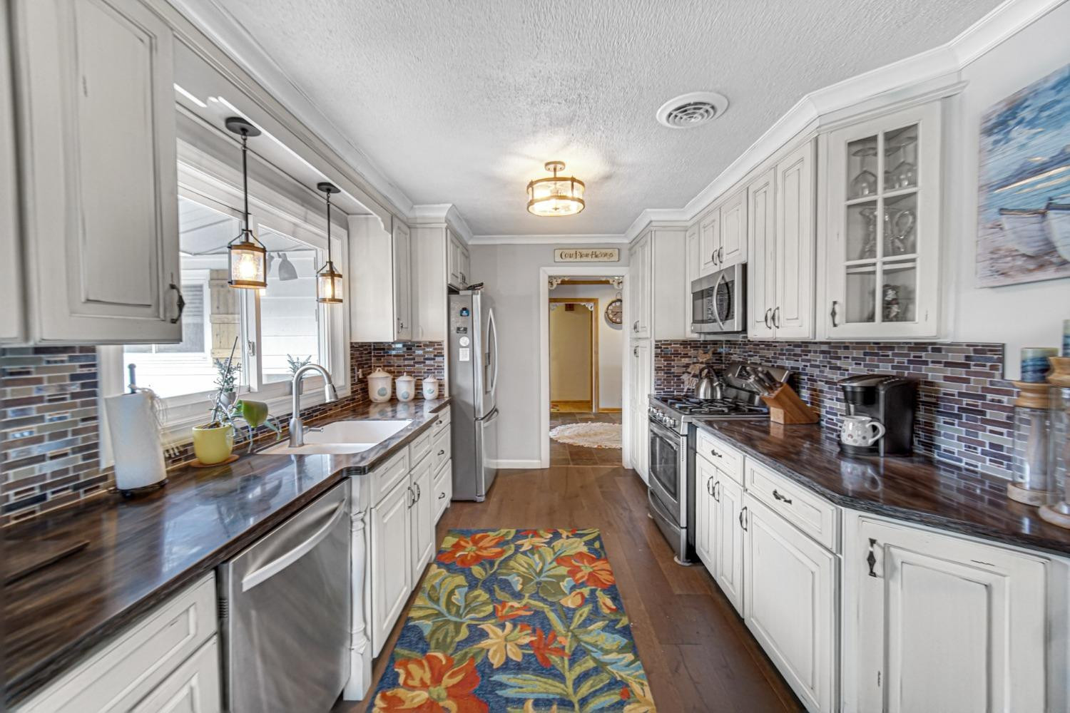42 Ogden Road Portage, IN 46368 - Photo 21 of 40 a kitchen with stainless steel appliances granite countertop a sink and cabinets