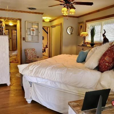 42 Ogden Road Portage, IN 46368 - Photo 25 of 40 a bedroom with a bed and a chandelier