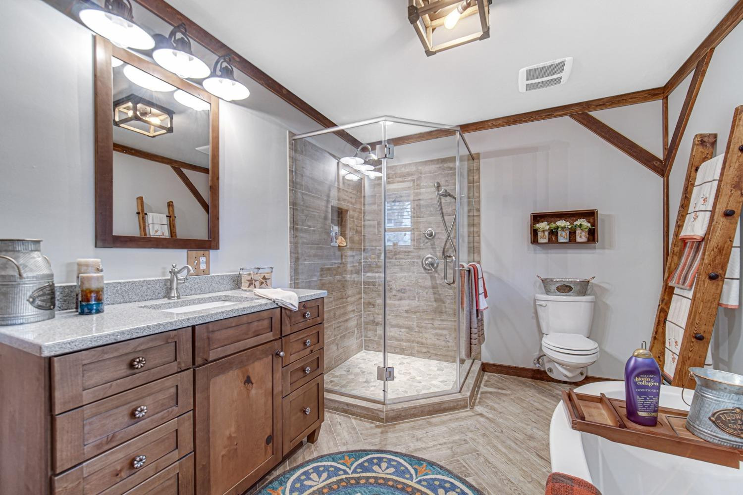 42 Ogden Road Portage, IN 46368 - Photo 26 of 40 a bathroom with a double vanity sink toilet and shower