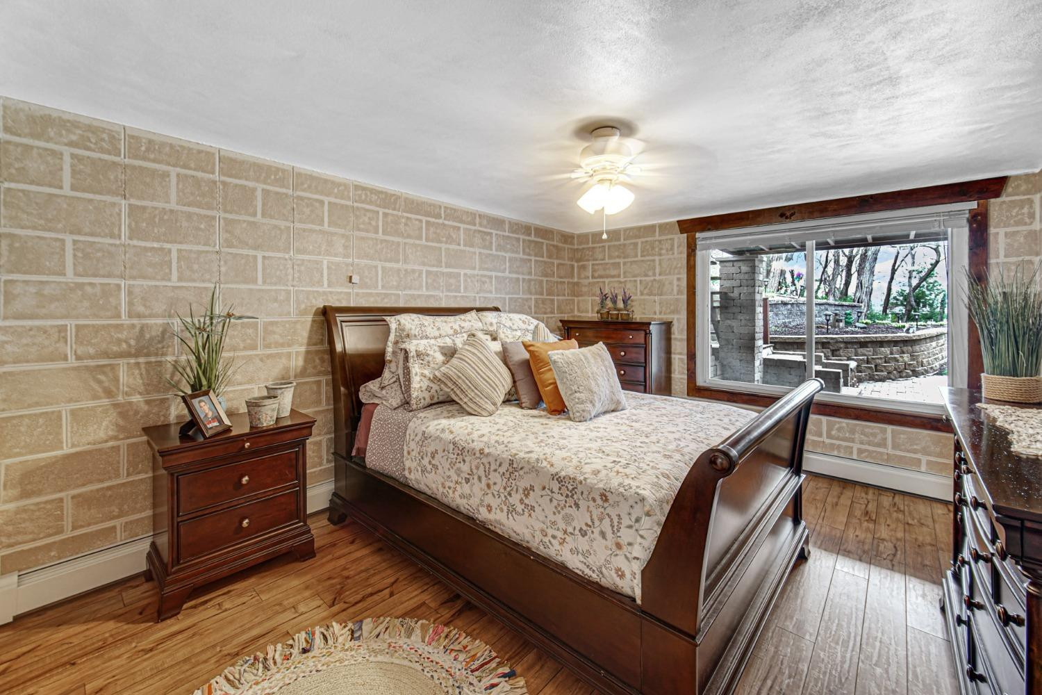 42 Ogden Road Portage, IN 46368 - Photo 29 of 40 a bedroom with a bed and wooden floor