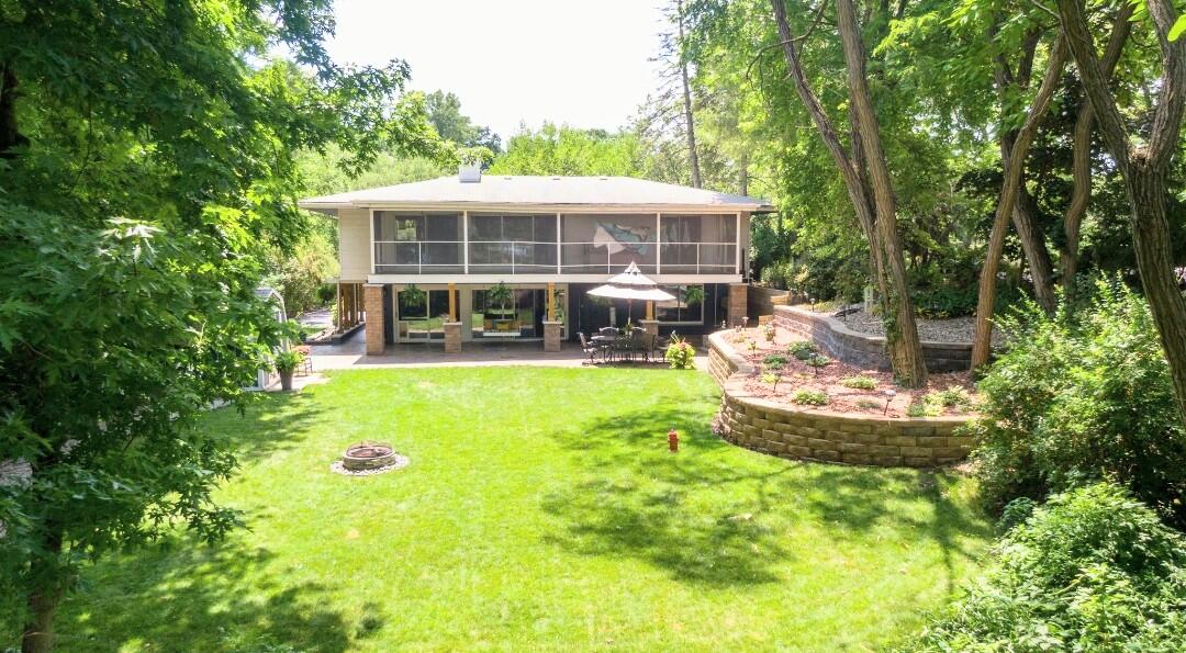 42 Ogden Road Portage, IN 46368 - Photo 6 of 40 a front view of a house with a yard table and chairs