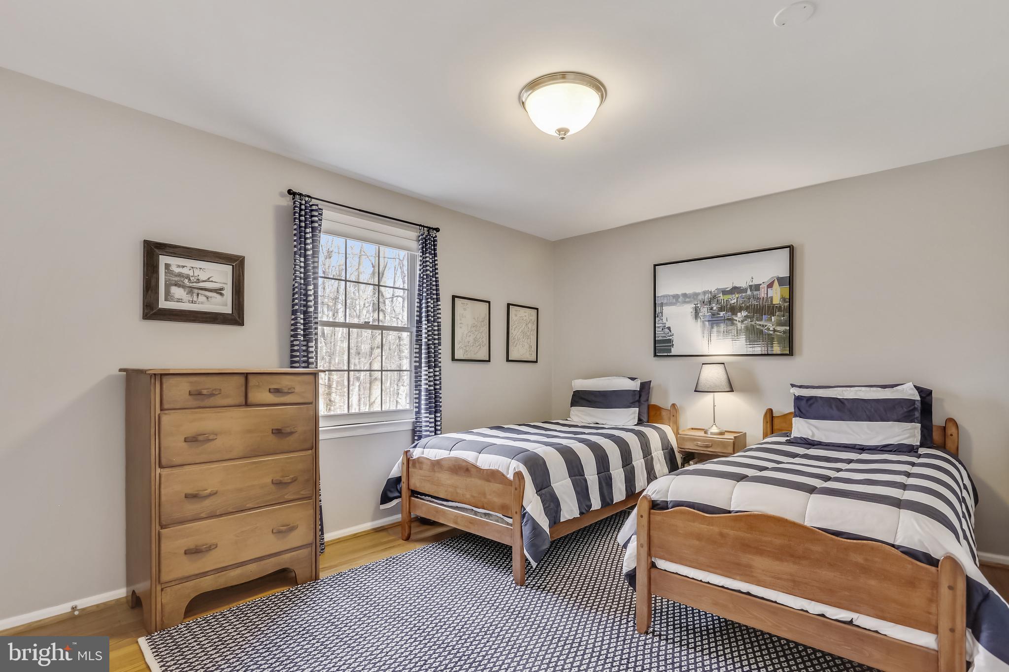 10783 Kinloch Road Silver Spring, MD 20903 - Photo 24 of 43 a bedroom with two beds and a dresser