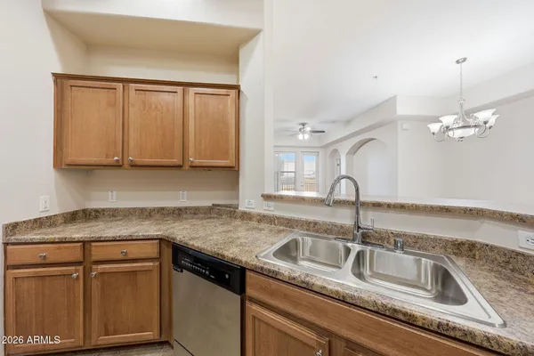 a kitchen with sink and cabinets