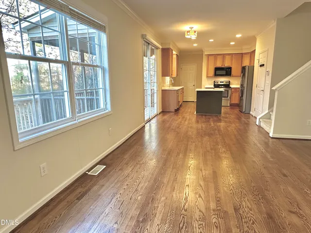 an aerial view of a house with yard