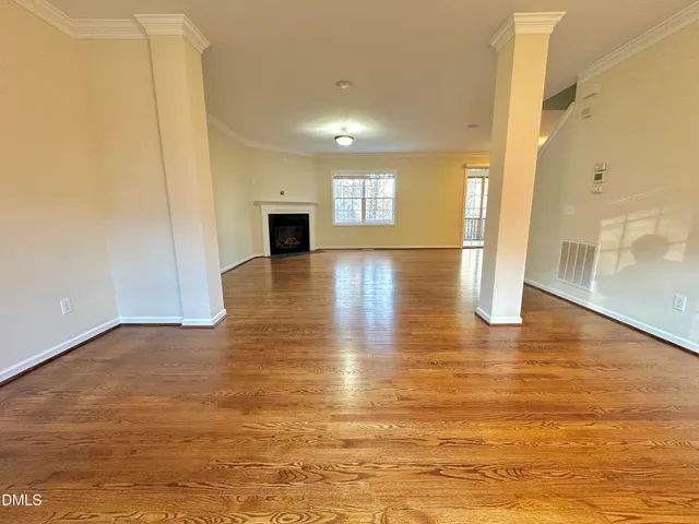 a view of a balcony with wooden floor