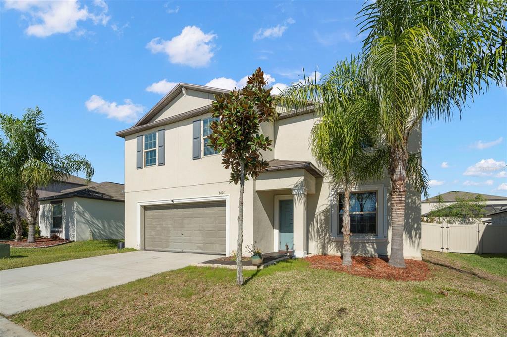 6601 Rainbow Springs Lane New Port Richey, FL 34653 - Photo 1 of 1 a front view of a house with a yard