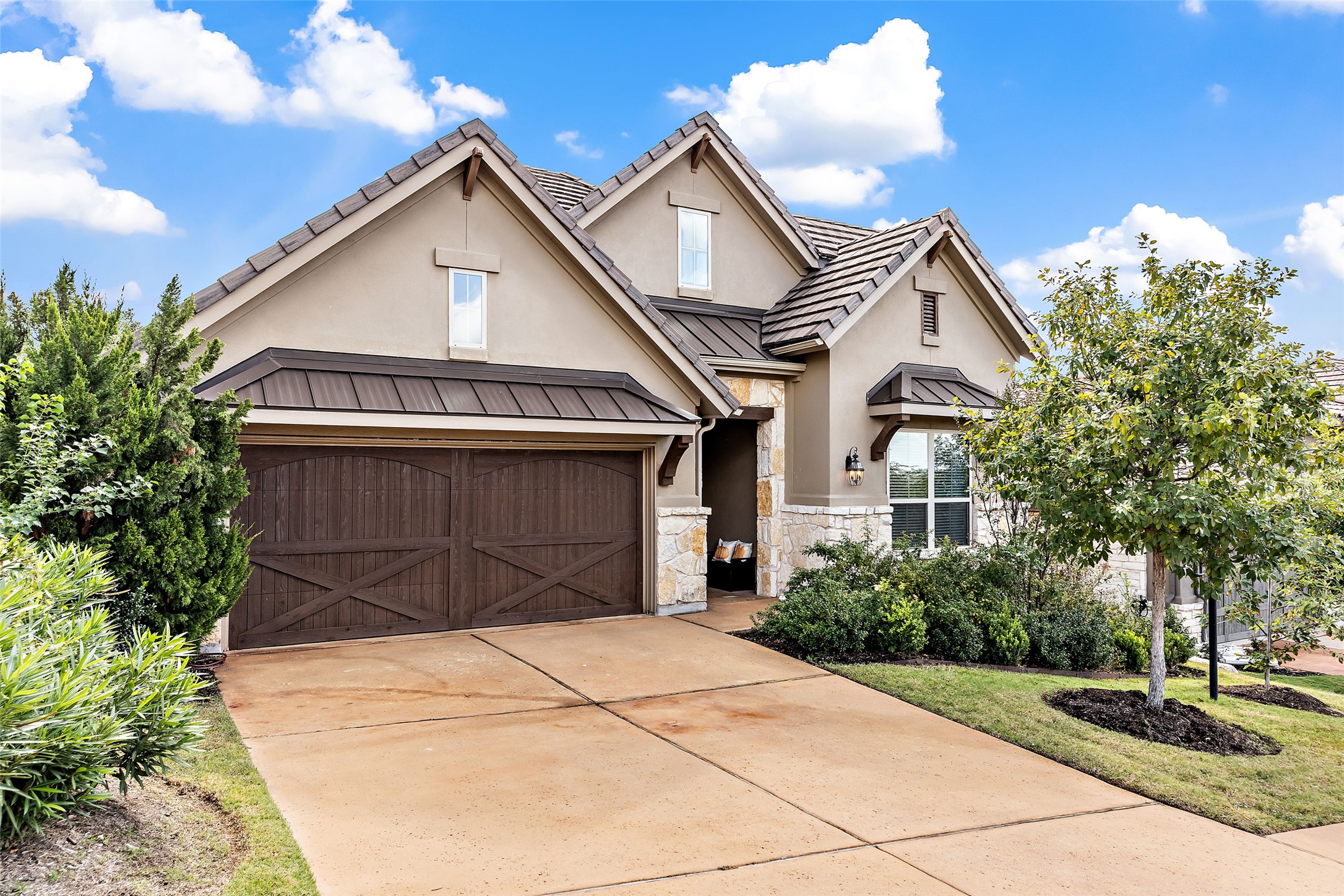 View of front of house with stone and stucco siding