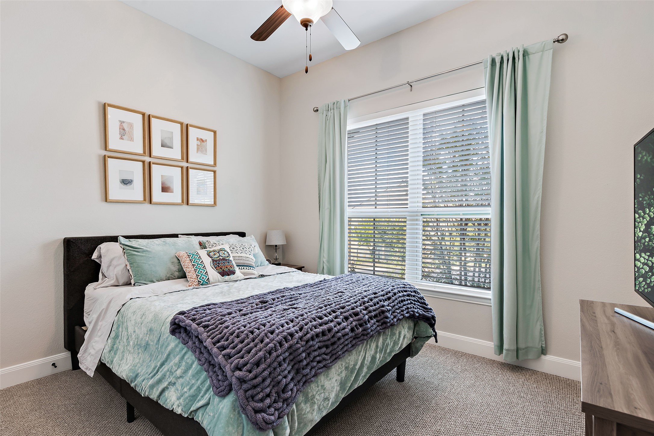 106 Maxwell Way, Unit 33 Austin, TX 78738 - Photo 18 of 40 Secondary bedroom with ceiling fan