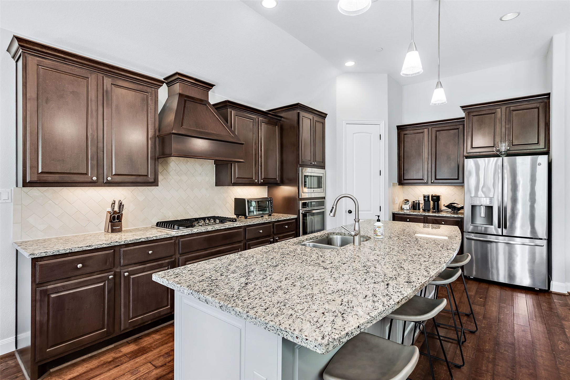 106 Maxwell Way, Unit 33 Austin, TX 78738 - Photo 29 of 40 Large kitchen island with plenty of room for bar stools