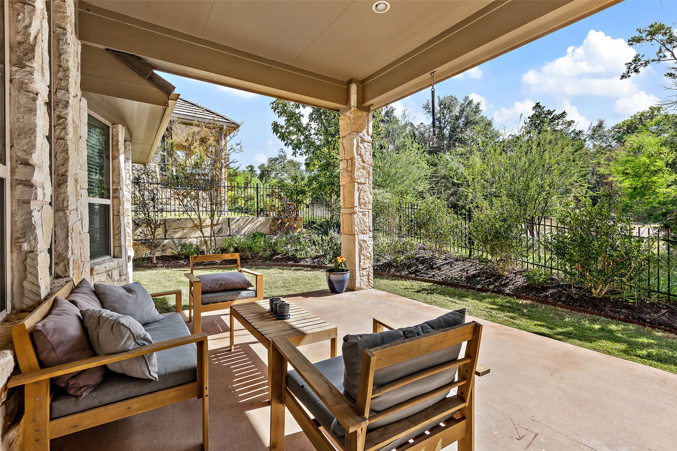 106 Maxwell Way, Unit 33 Austin, TX 78738 - Photo 6 of 40 Outdoor covered patio with fan and recessed lights