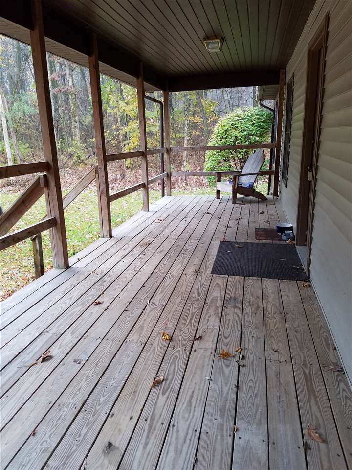 3224 South Seldom Scene Road Oregon, IL 61061 - Photo 13 of 17 a view of balcony with wooden floor and outdoor space