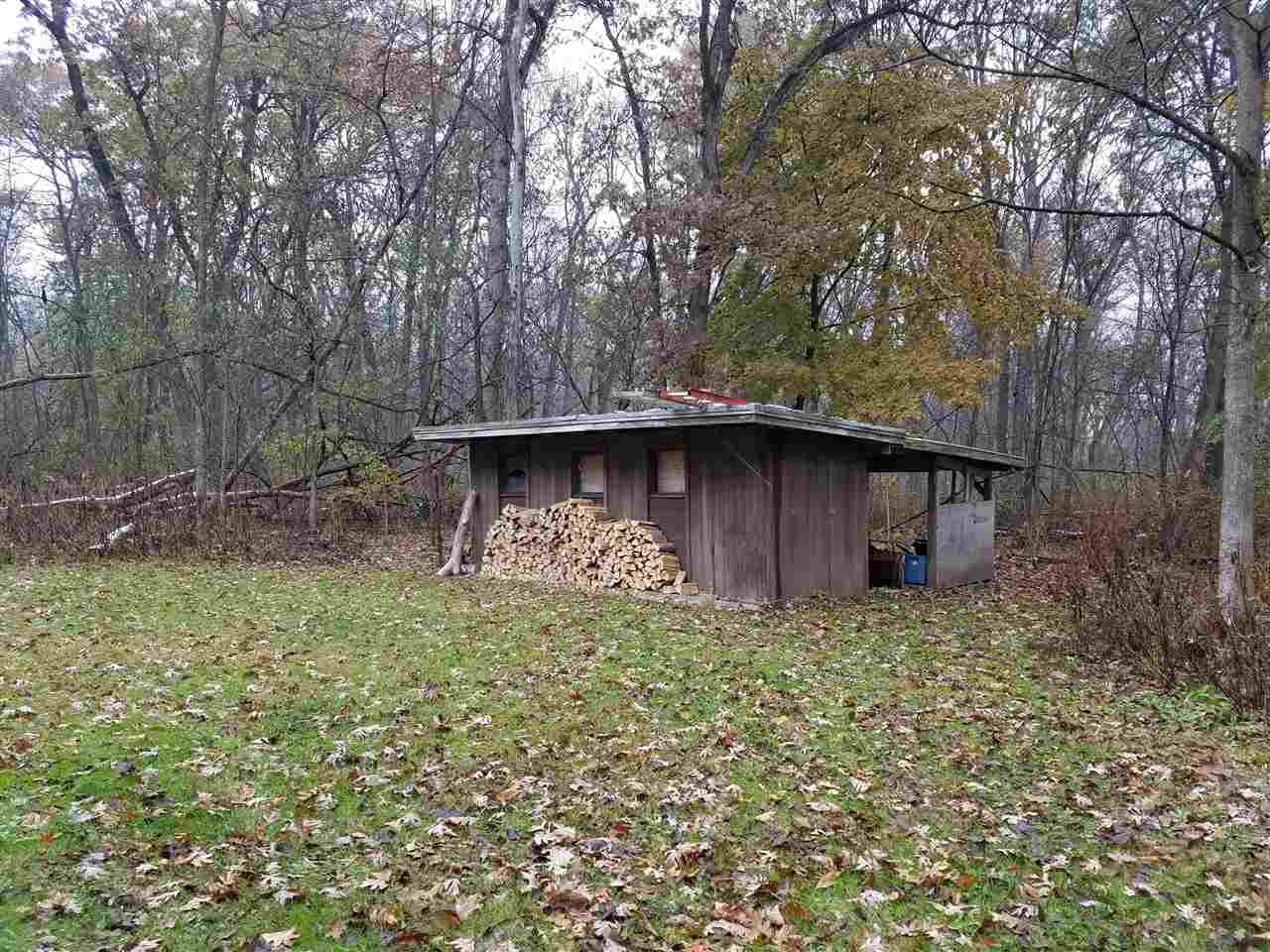 3224 South Seldom Scene Road Oregon, IL 61061 - Photo 16 of 17 a backyard of a house with lots of green space