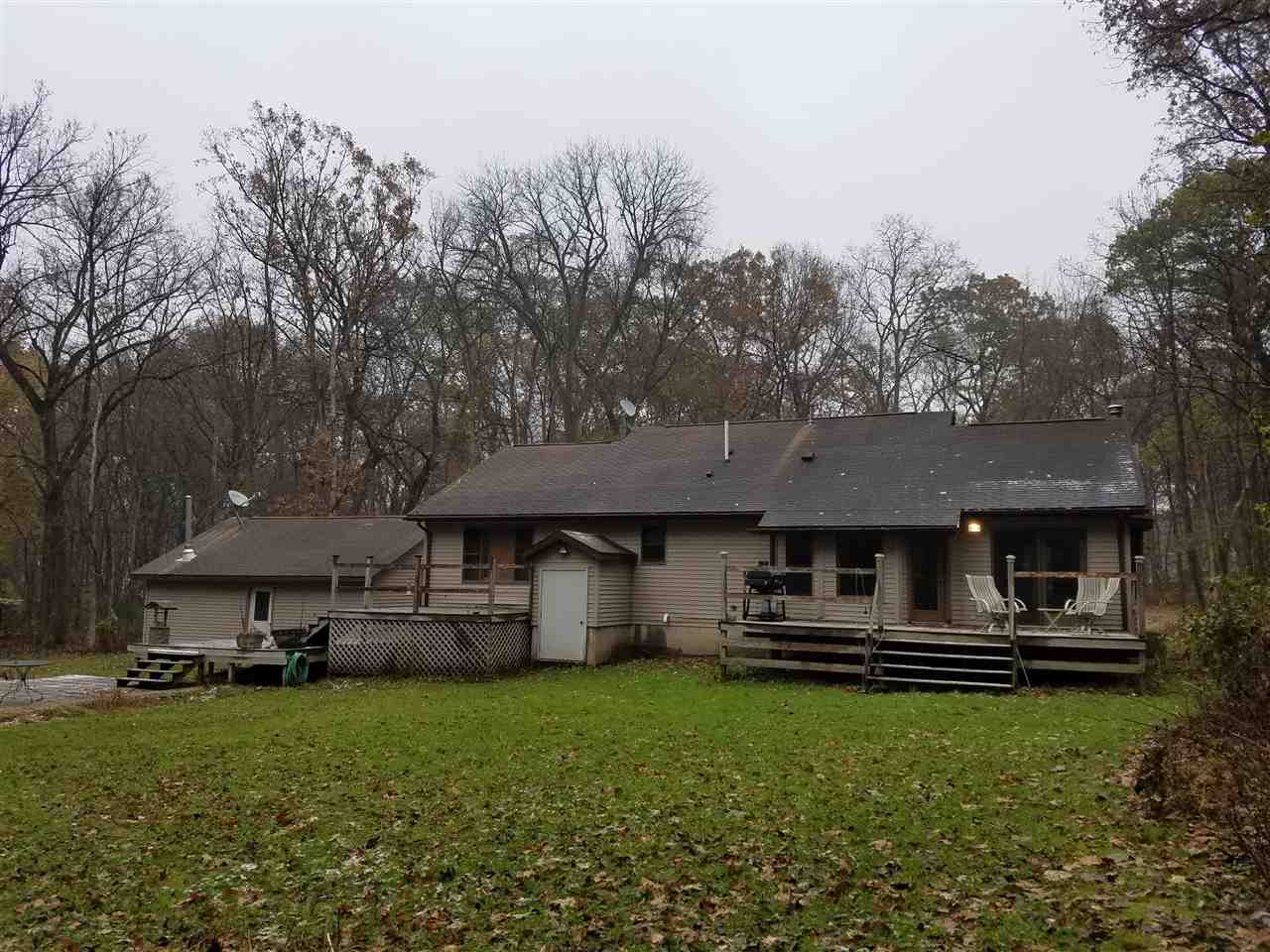 3224 South Seldom Scene Road Oregon, IL 61061 - Photo 17 of 17 a front view of a house with a garden and trees
