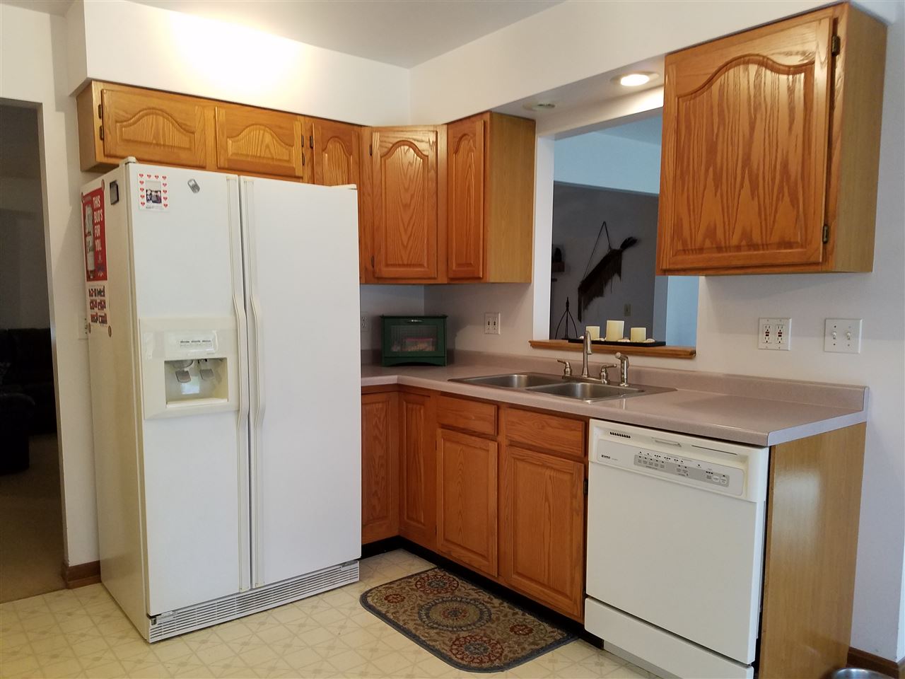 3224 South Seldom Scene Road Oregon, IL 61061 - Photo 3 of 17 a kitchen with stainless steel appliances granite countertop a refrigerator and a sink