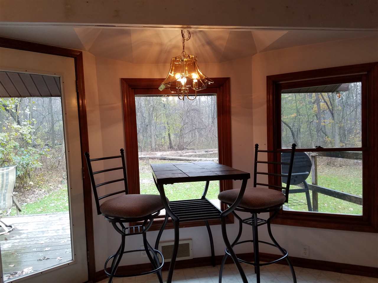 3224 South Seldom Scene Road Oregon, IL 61061 - Photo 4 of 17 a view of a dining room with furniture window and outside view