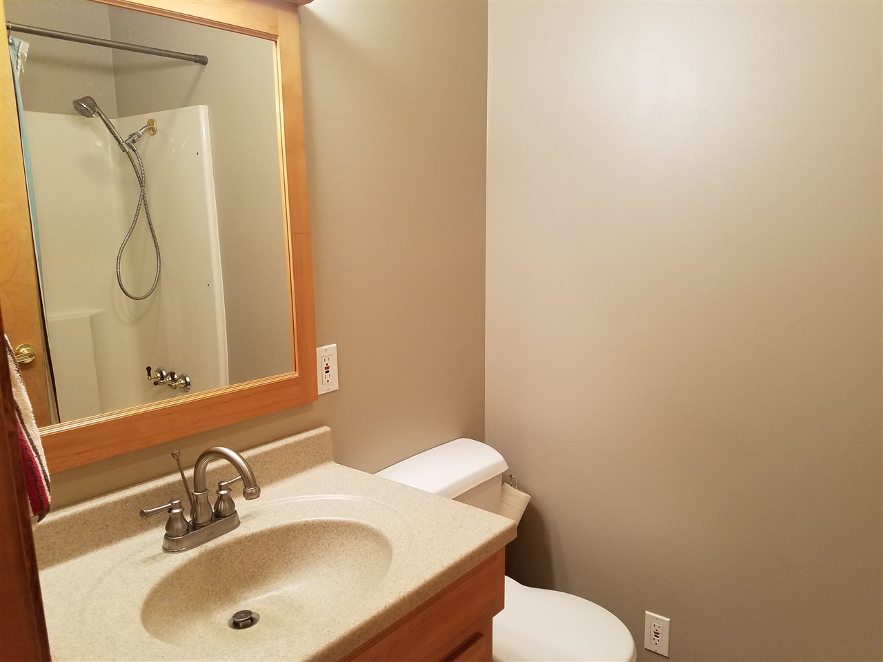 3224 South Seldom Scene Road Oregon, IL 61061 - Photo 9 of 17 a bathroom with a sink and mirror with toilet