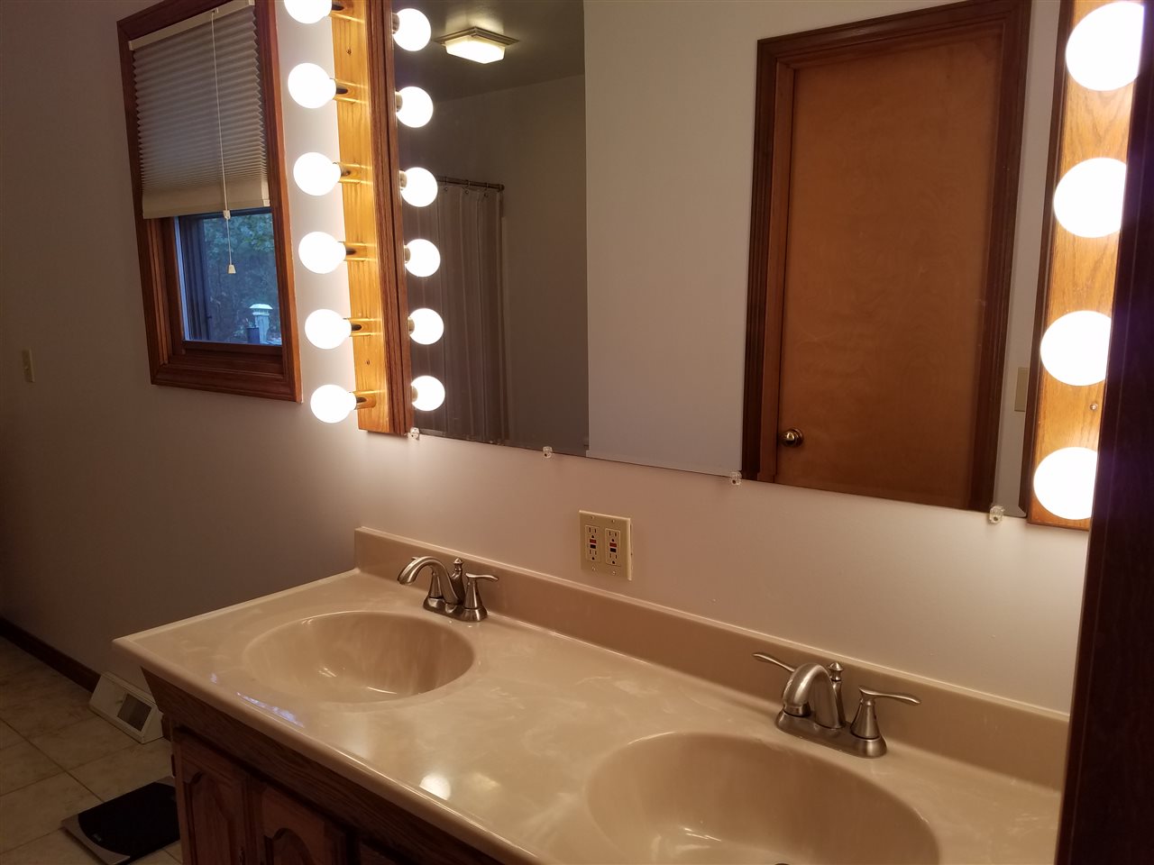 3224 South Seldom Scene Road Oregon, IL 61061 - Photo 10 of 17 a bathroom with a sink and a mirror