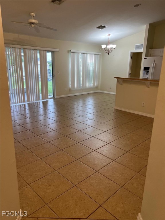 2923 3rd Street Southwest Lehigh Acres, FL 33976 - Photo 11 of 19 a view of a hallway with wooden floor and a chandelier