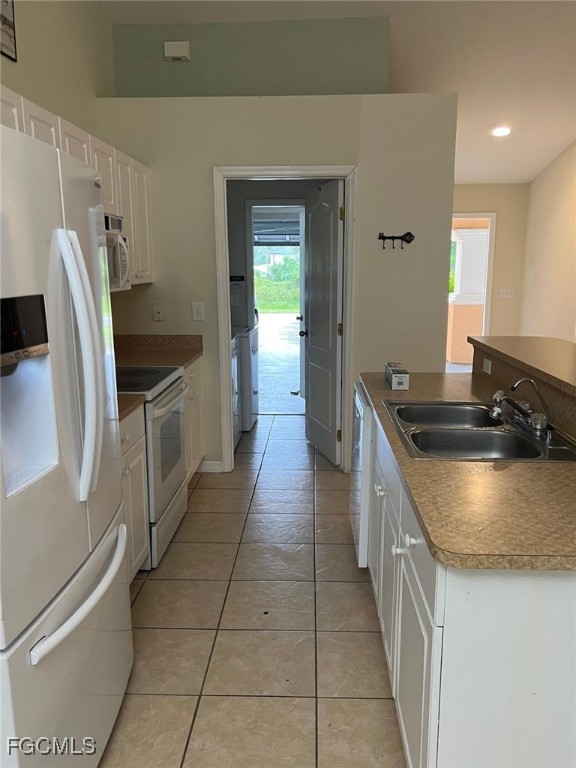 2923 3rd Street Southwest Lehigh Acres, FL 33976 - Photo 13 of 19 a kitchen with stainless steel appliances granite countertop a sink a stove and a refrigerator