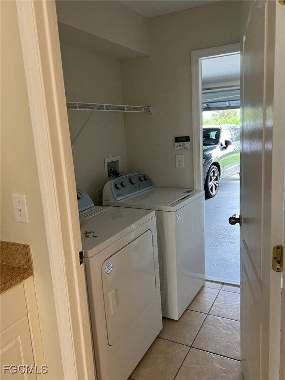 2923 3rd Street Southwest Lehigh Acres, FL 33976 - Photo 14 of 19 a utility room with dryer and washer