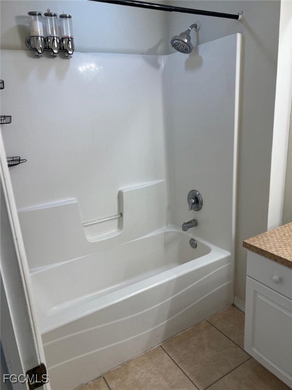 2923 3rd Street Southwest Lehigh Acres, FL 33976 - Photo 16 of 19 a bathroom with a tub and a shower