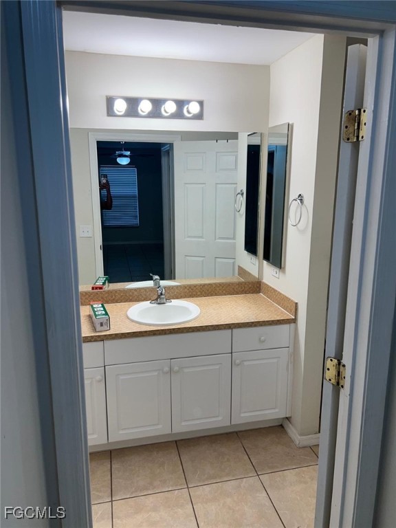 2923 3rd Street Southwest Lehigh Acres, FL 33976 - Photo 17 of 19 a bathroom with a sink and a mirror