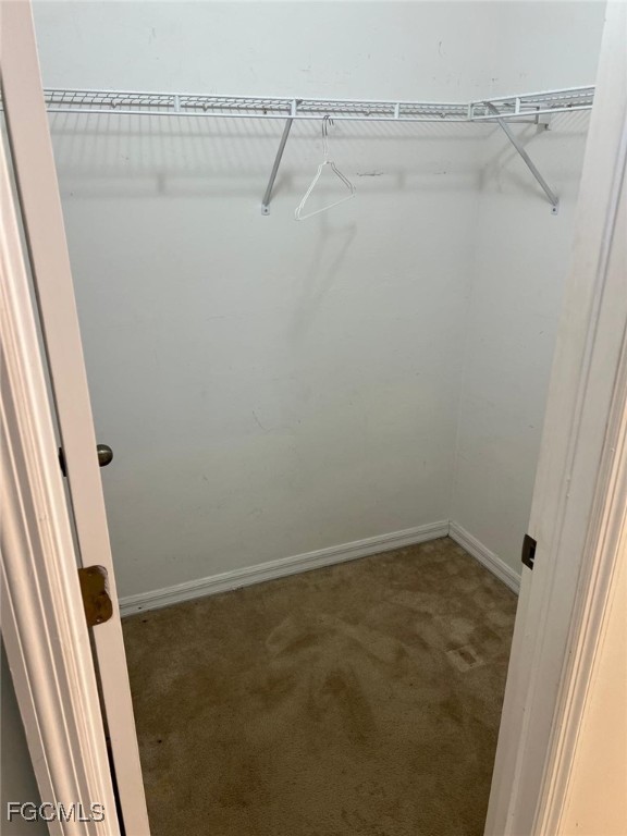 2923 3rd Street Southwest Lehigh Acres, FL 33976 - Photo 18 of 19 a view of a room with racks on the wall