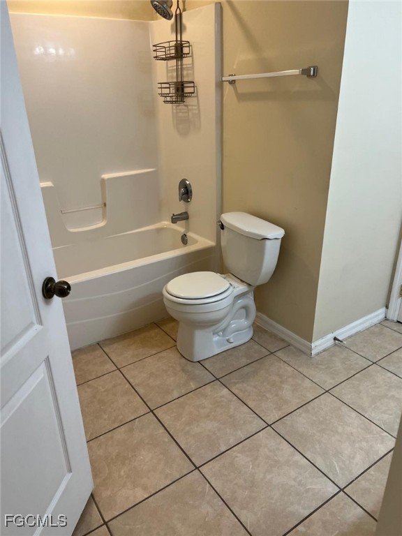 2923 3rd Street Southwest Lehigh Acres, FL 33976 - Photo 9 of 19 a bathroom with a toilet a sink and shower