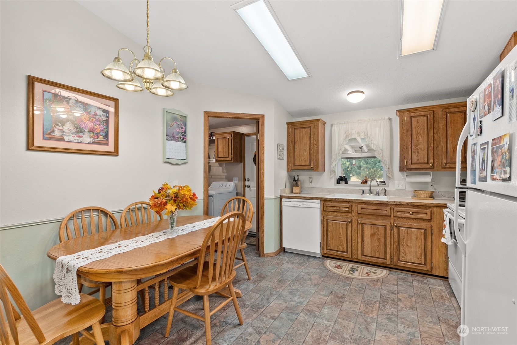 824 Winlock-Vader Road Winlock, WA 98596 - Photo 15 of 36 a dining room with furniture a chandelier and window