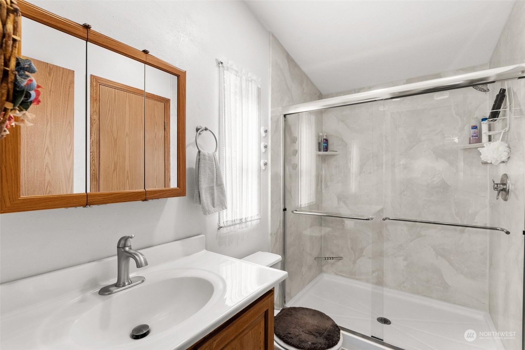 824 Winlock-Vader Road Winlock, WA 98596 - Photo 23 of 36 a bathroom with a sink shower and a mirror