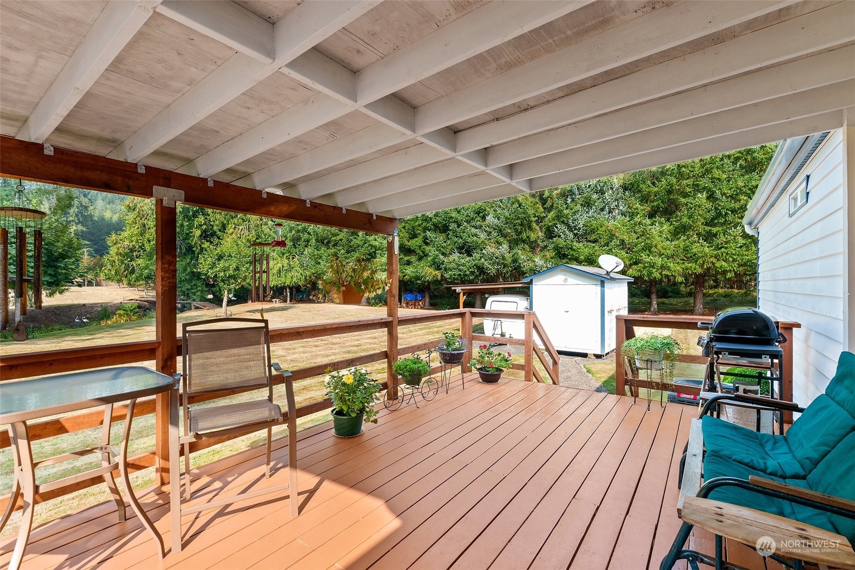 824 Winlock-Vader Road Winlock, WA 98596 - Photo 26 of 36 a view of balcony with wooden floor and outdoor seating
