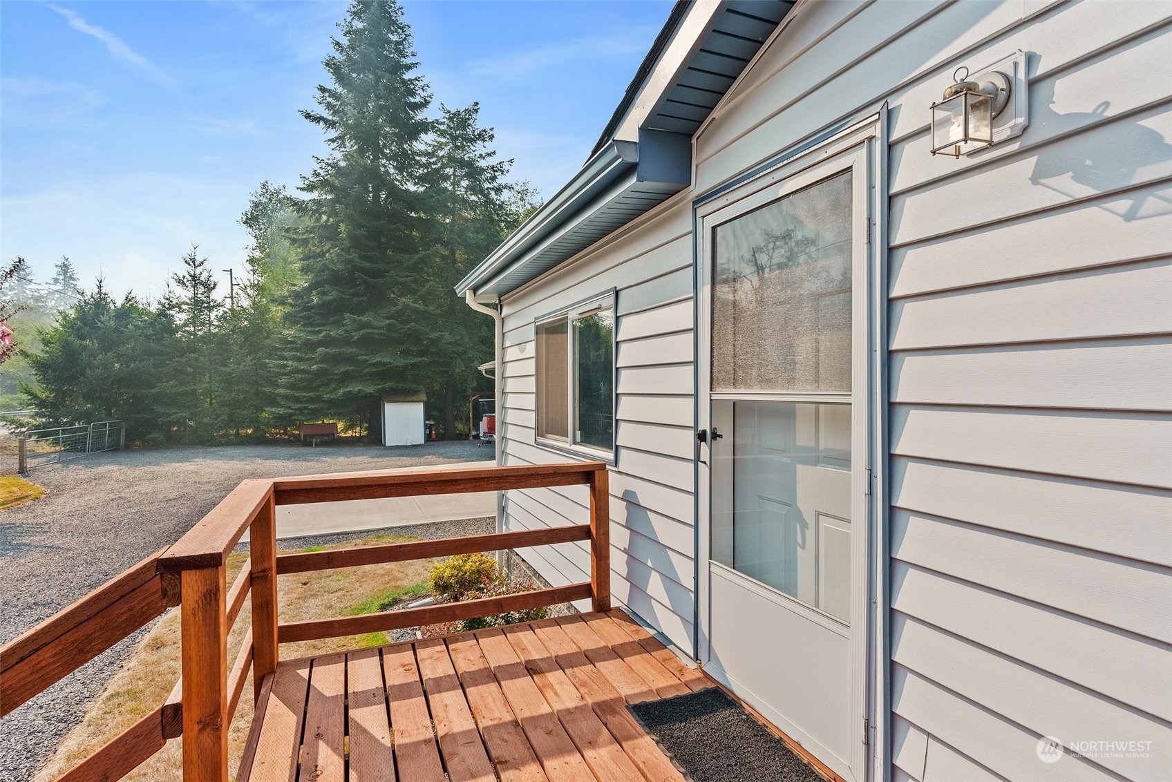 824 Winlock-Vader Road Winlock, WA 98596 - Photo 10 of 36 a view of backyard with deck and outdoor seating
