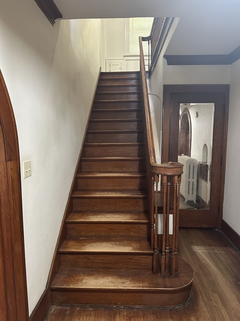 1418 North Sheridan Road Peoria, IL 61606 - Photo 17 of 34 a view of entryway and hall with wooden floor