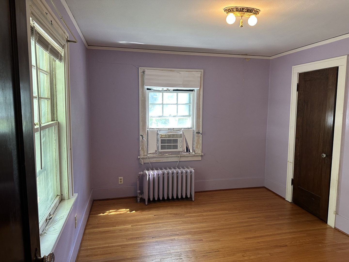 1418 North Sheridan Road Peoria, IL 61606 - Photo 23 of 34 a view of an empty room with wooden floor and a window