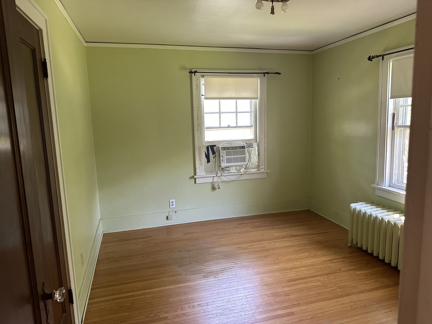 1418 North Sheridan Road Peoria, IL 61606 - Photo 25 of 34 a view of an empty room with wooden floor and a window
