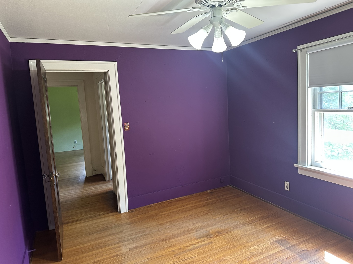 1418 North Sheridan Road Peoria, IL 61606 - Photo 26 of 34 a view of empty room with window and wooden floor
