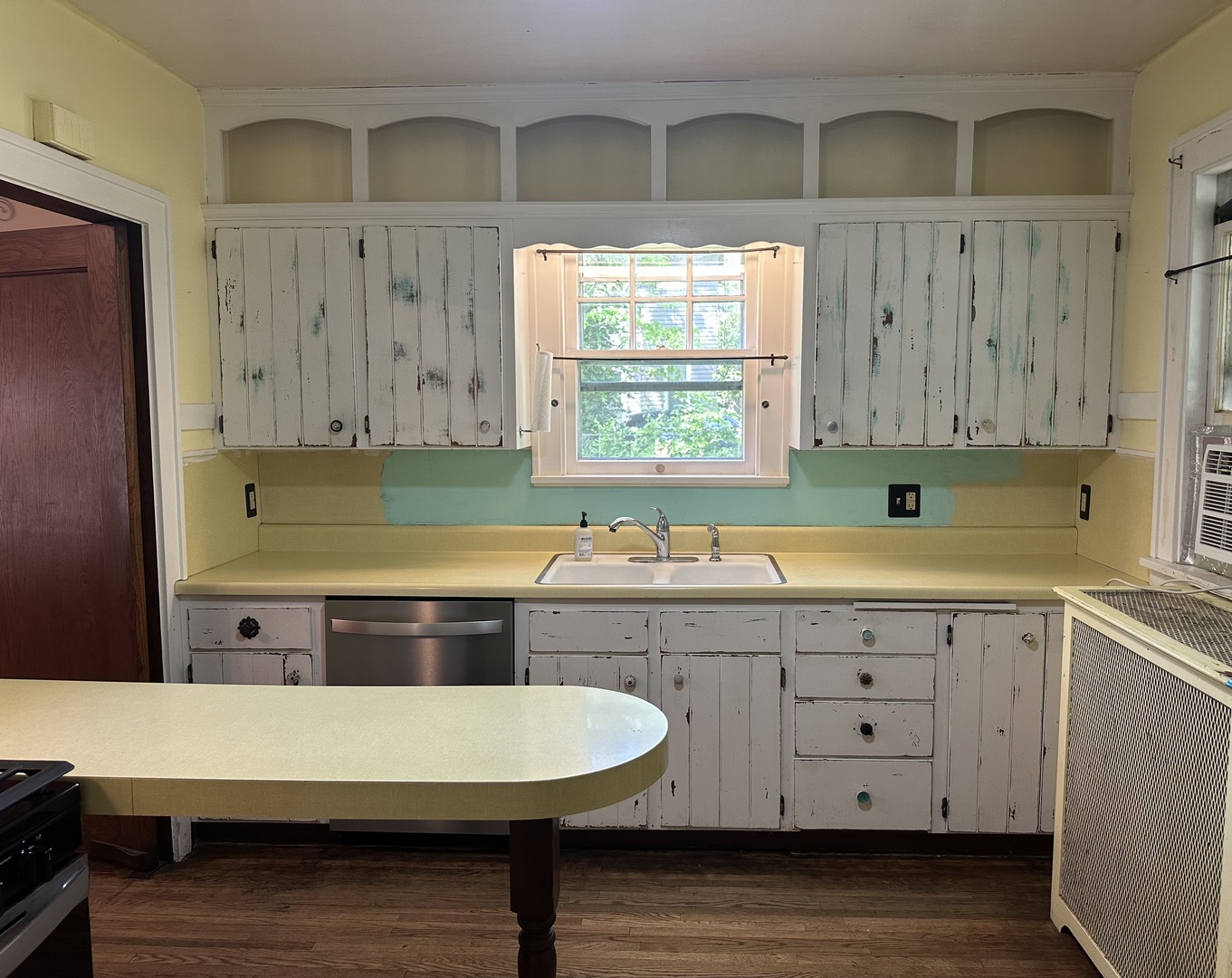 1418 North Sheridan Road Peoria, IL 61606 - Photo 4 of 34 a kitchen with a stove a sink and a cabinets