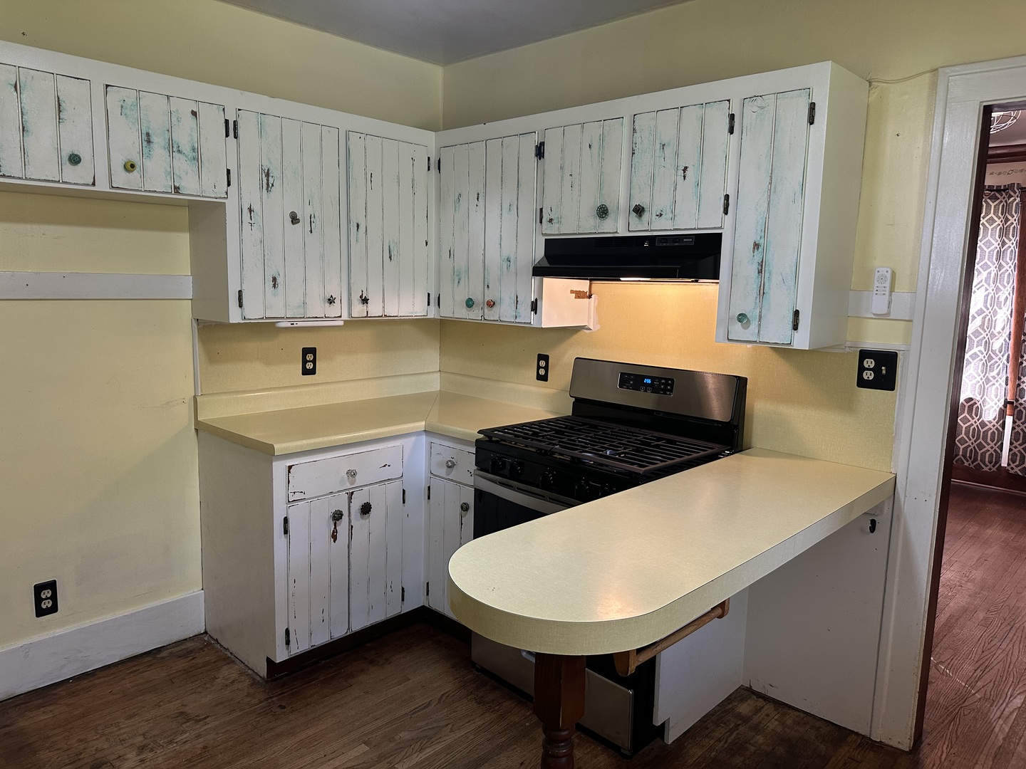 1418 North Sheridan Road Peoria, IL 61606 - Photo 7 of 34 a kitchen with wooden cabinets and white appliances
