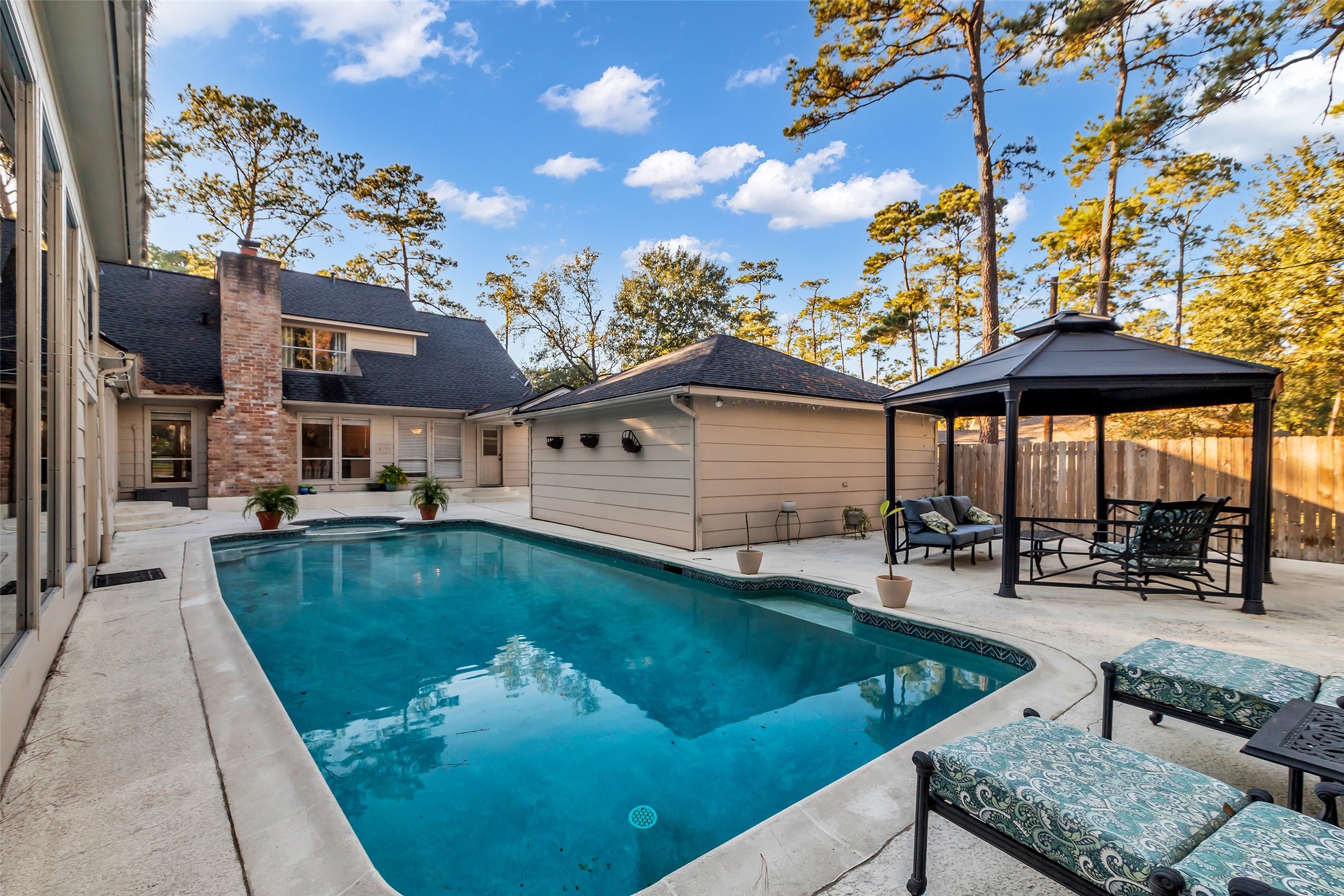 24102 Northcrest Drive Spring, TX 77389 - Photo 24 of 31 This inviting backyard oasis promises endless outdoor fun with its sparkling pool, cozy gazebo, and ample lounging space, perfect for r entertaining.