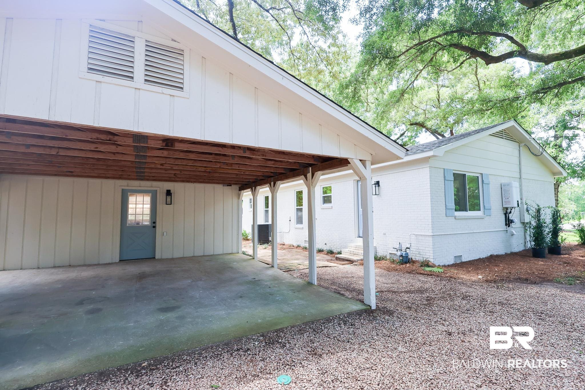 12190 Pecan Grove Street Magnolia Springs, AL 36555 - Photo 30 of 45 Back of house with central AC unit